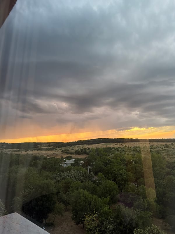 Storm clouds and golden light over Burgas Bay at sunset