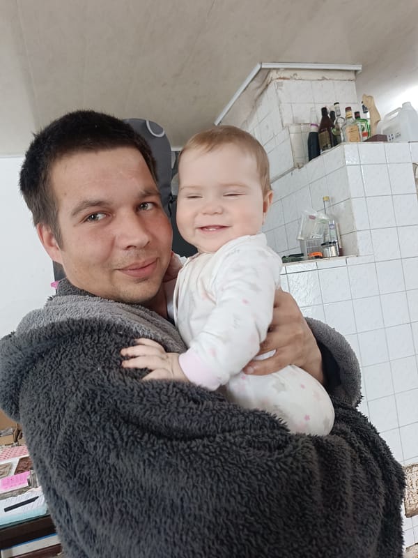 Family moments captured during rainy morning in Rusalevka, Russia