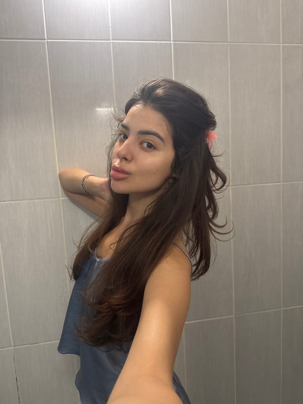 Bathroom selfie session in Plovdiv, blue top and pink flower