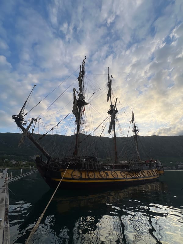 Historical sailing ship docks in Kotor harbor, Montenegro