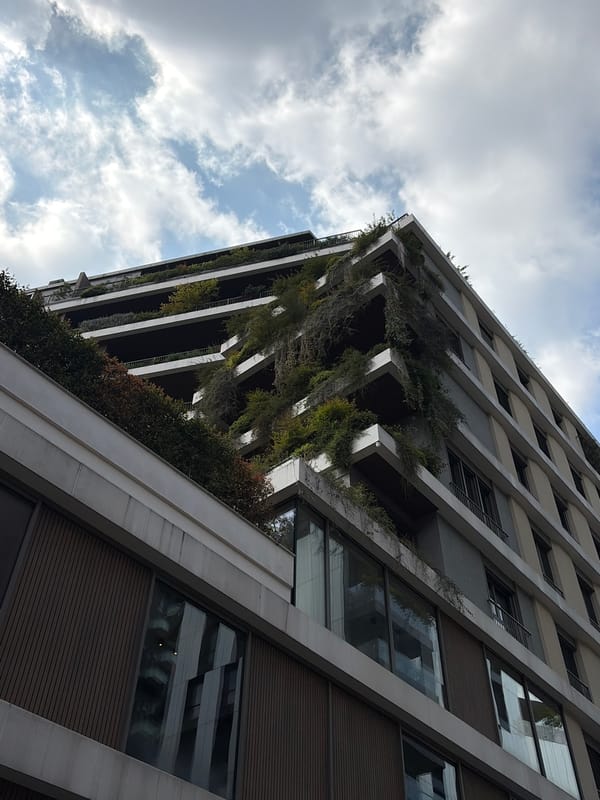 Modern building with vertical gardens observed in Milan