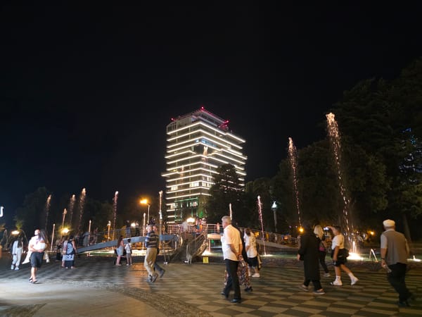 Batumi promenade at night: fountains, lights, crowds