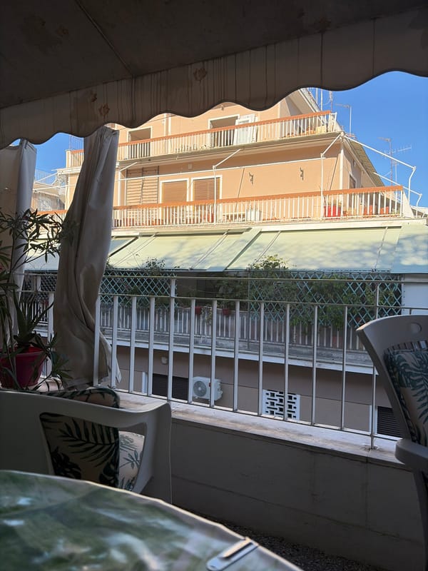 Athens balcony life: plants, street views, and quiet morning details