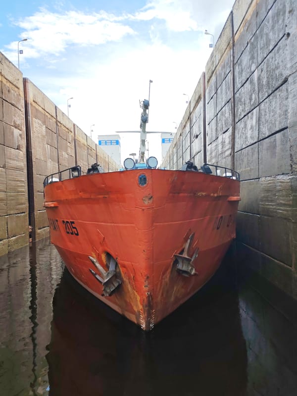 Cargo ships transit Volga-Baltic Waterway locks in Devyatiny, Russia