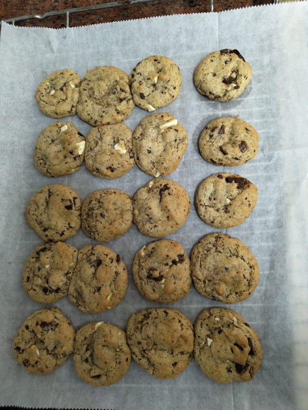 Eighteen chocolate chip cookies documented on parchment paper in Tel Aviv