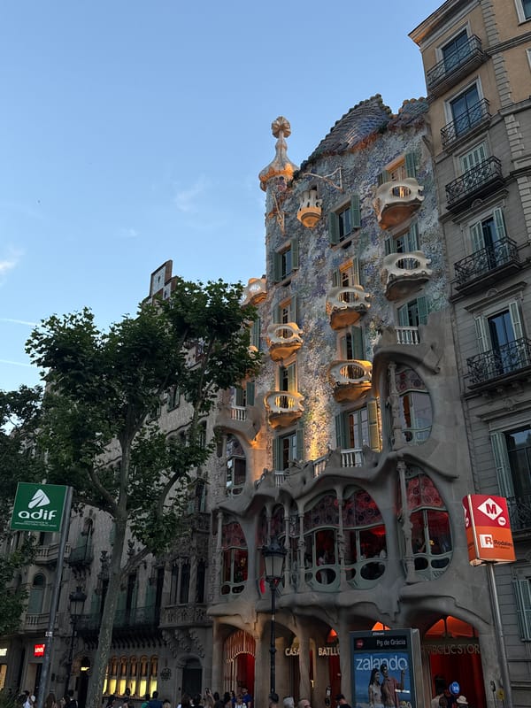 Crowds gather along Barcelona's Passeig de Gràcia near landmarks