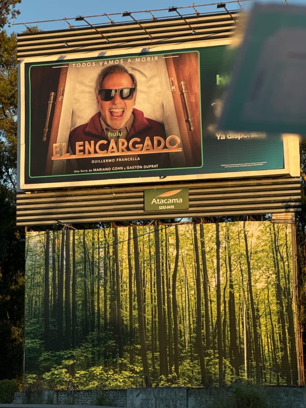 Buenos Aires street scene captures entertainment and perfume billboards