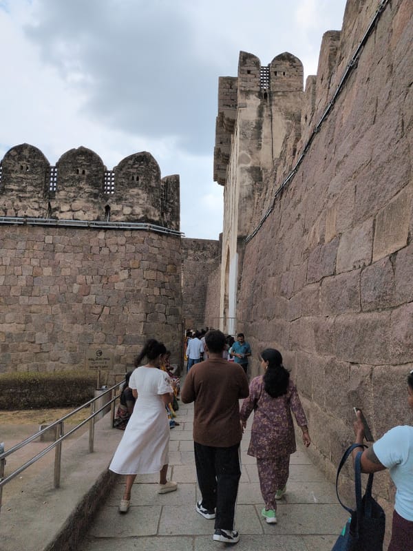 Tourists explore historic Golconda Fort under cloudy Hyderabad skies