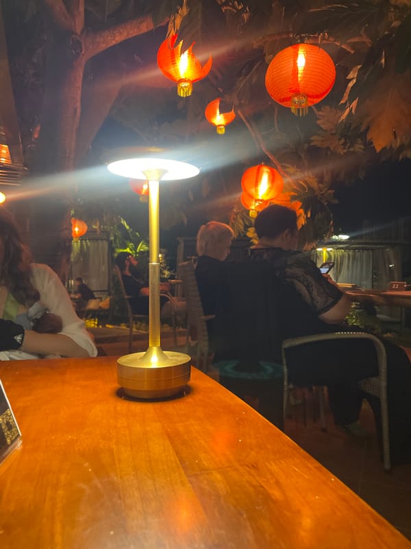 Evening gathering with lanterns and music at Vietnamese heritage site