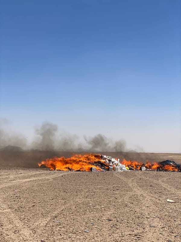 Waste fire burns in arid Daman, Afghanistan