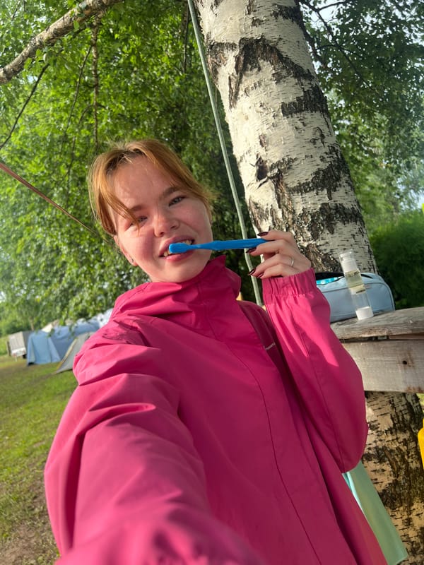Morning camp life at a birch-lined site in Сергино, Russia