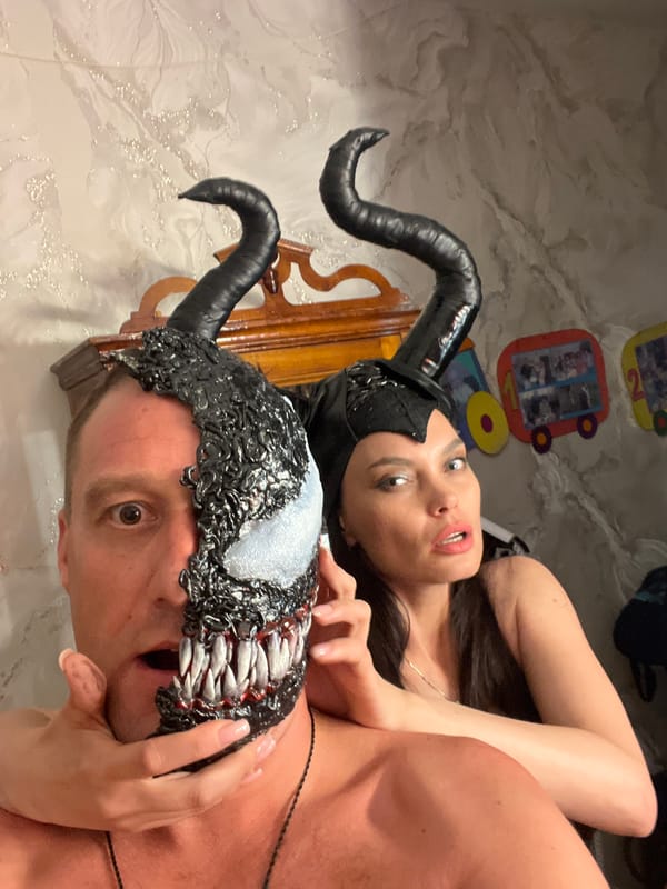 Venom mask and demon horns cosplay at home in Perm