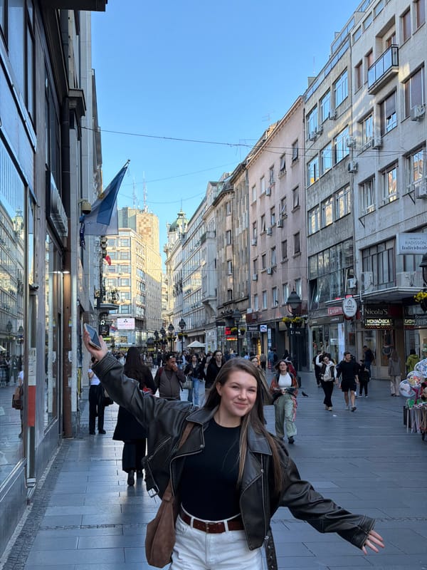 Woman poses on busy Belgrade pedestrian street Tuesday afternoon