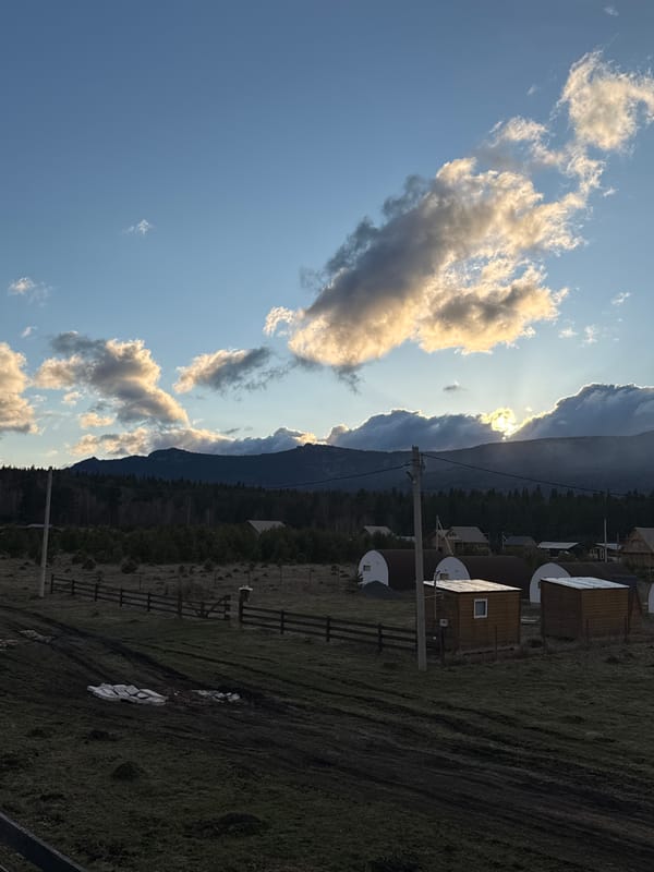 Rural cabins and mountain landscape documented in Tyulyuk, Russia