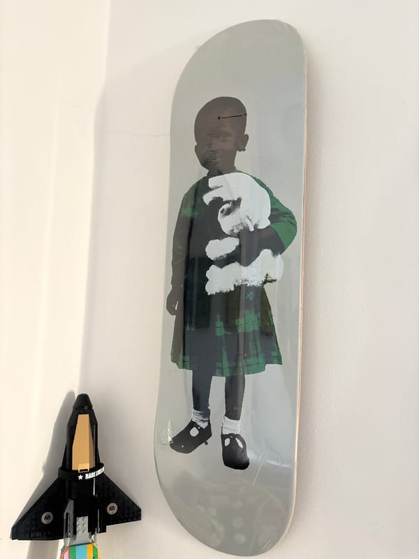 Skateboard and LEGO spaceship spotted arranged on London shelf