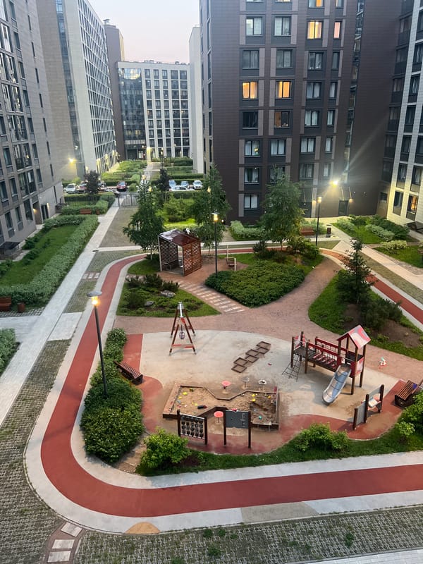Modern apartment complex photographed at dusk from multiple perspectives