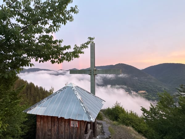 Metallic cross on a hilltop at dusk, Strazha, Bulgaria