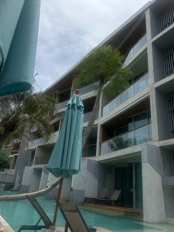 Morning poolside relaxation documented at Rawai Thailand resort complex