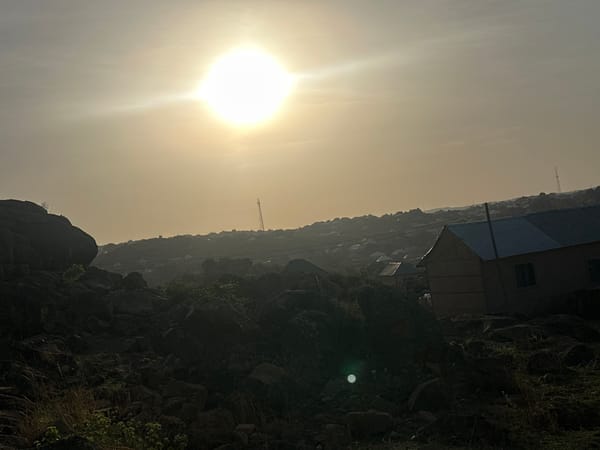 Bright sun creates glare over rocky Jos landscape