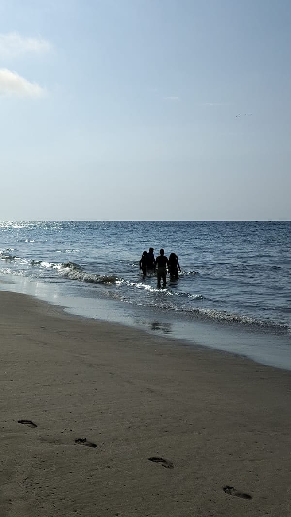 Beachgoers enjoy sunny evening at Zorritos, Peru coastline