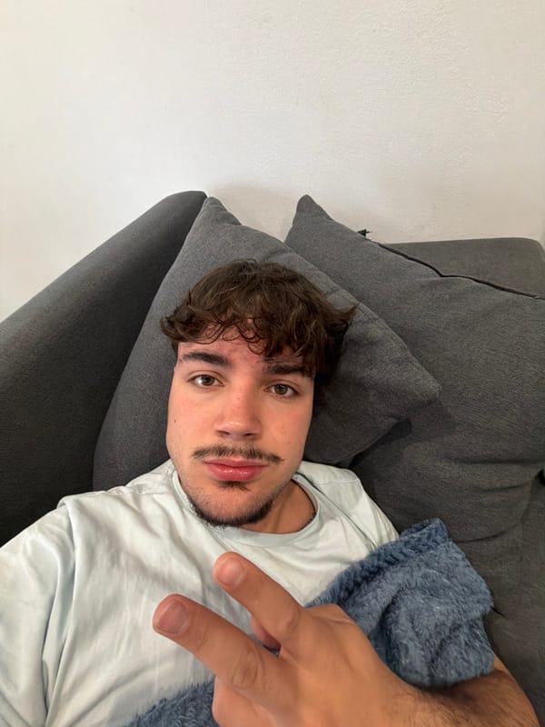 Young man takes casual selfies on couch in Rijeka