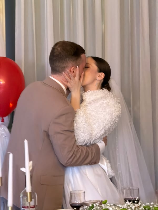 Wedding couple photographed kissing in Chaikovsky, Russia