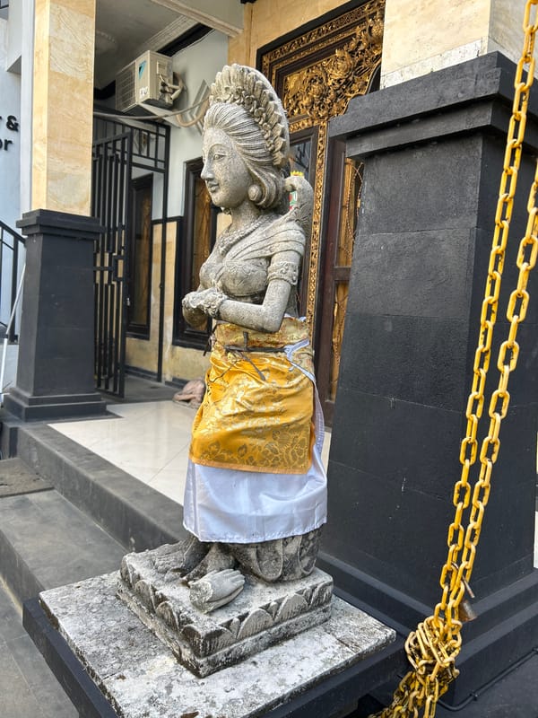 Ornate Balinese compound in Abiansemal, statues and street details