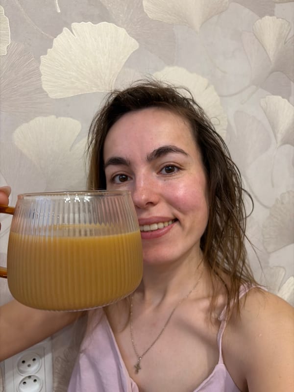 Woman enjoys morning coffee and pancakes in Izhevsk