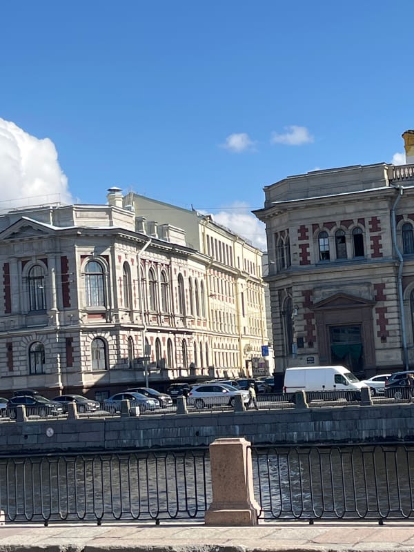 Tourist boat and historic architecture observed in Saint Petersburg