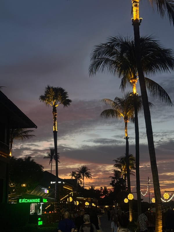 Tropical sunset fades into a lit-up banana pancake stand