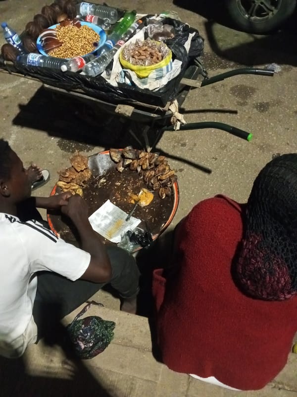 Evening street vendors sell fruits and goods in Bukuru