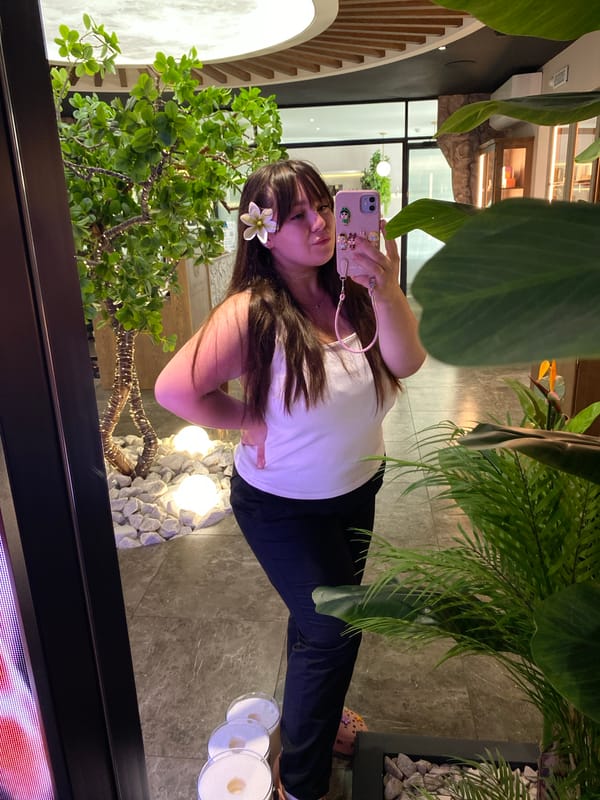 Selfie session in a minimalist Votkinsk interior, white flower in hair