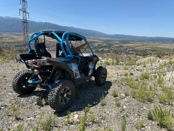 Can-Am Maverick X3 parked on rocky hillside near Kostenets