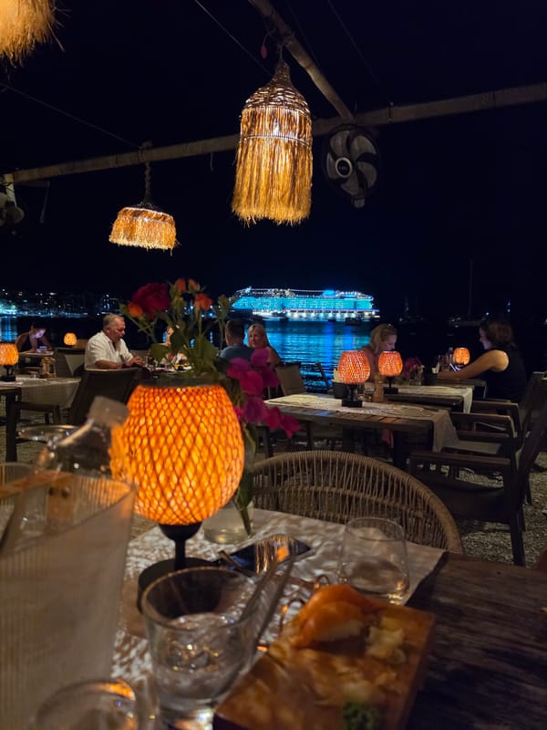 Sunset dinner on the Bodrum waterfront, cruise ship in view