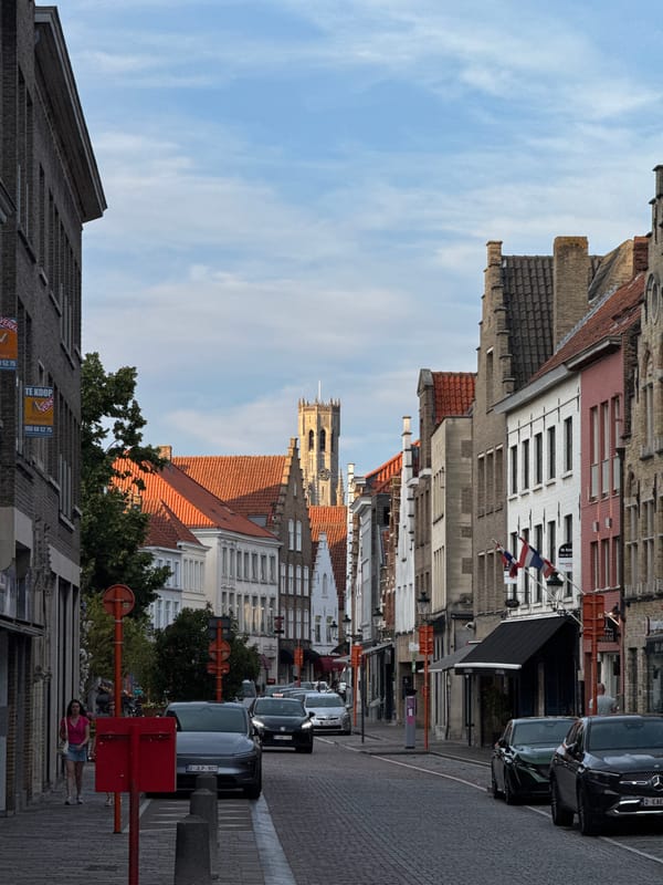 Bruges cobblestone street with the Belfry in view