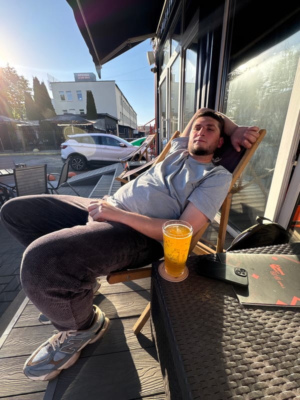 Man enjoys afternoon beer and fries at Minsk cafe