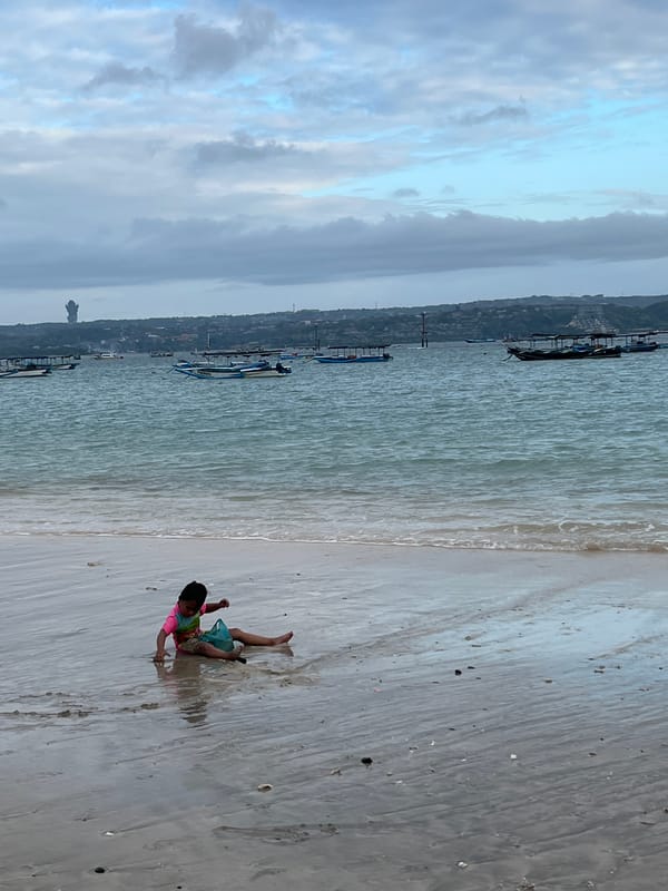 Kuta Beach morning: camel rides, shoreline play, and coastal tourism