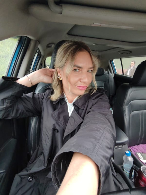 Car selfie session with interior details and book