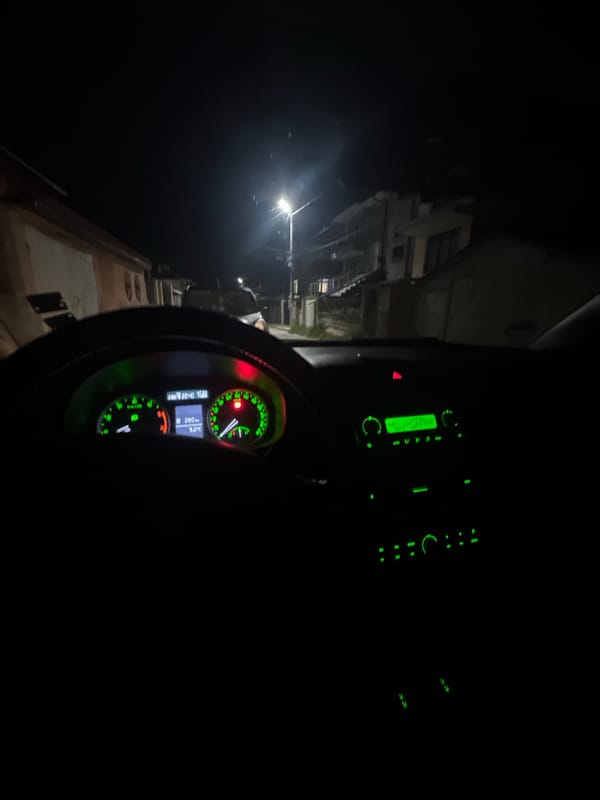 Vehicle interior with green dashboard lighting observed