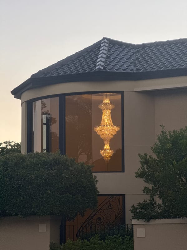 Woman in headphones photographed outside South Perth building