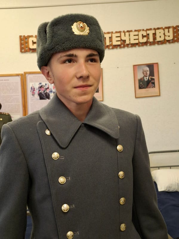 Man in Soviet-style military attire observed indoors in Russia