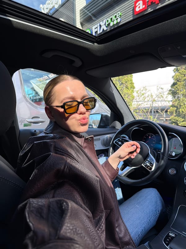 Person photographed in car and outdoors in Riga