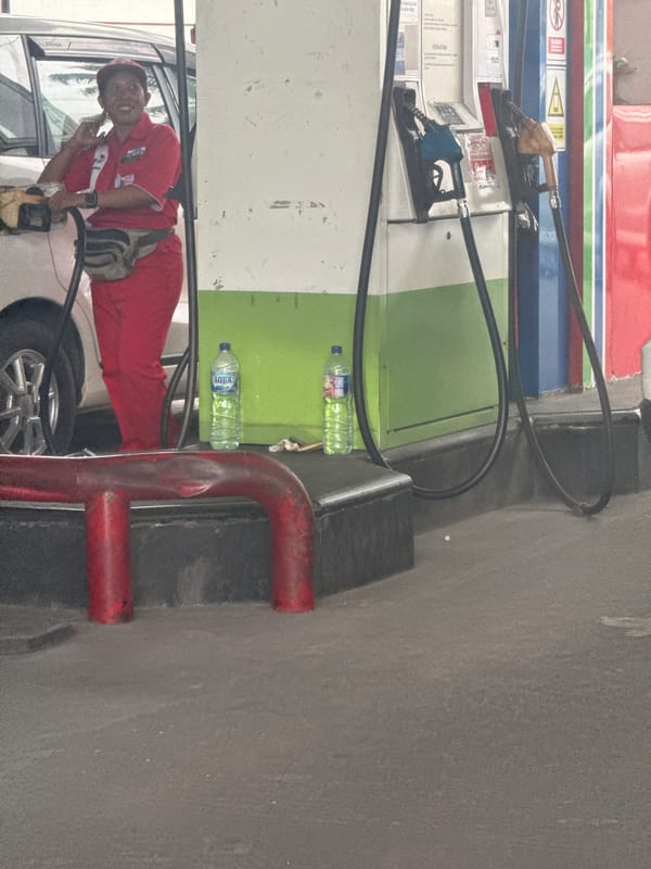 Uniformed worker at petrol station in Nusa Dua, Indonesia