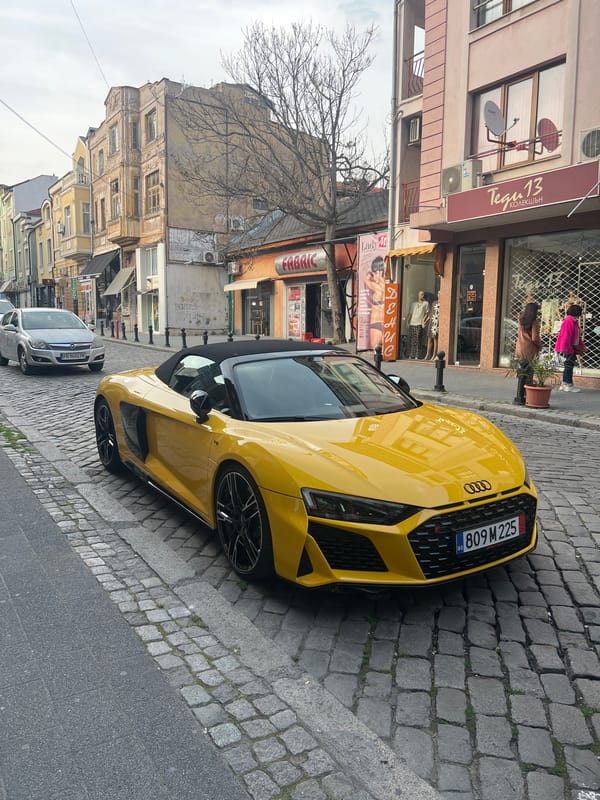 Yellow convertible, white dove spotted in urban area