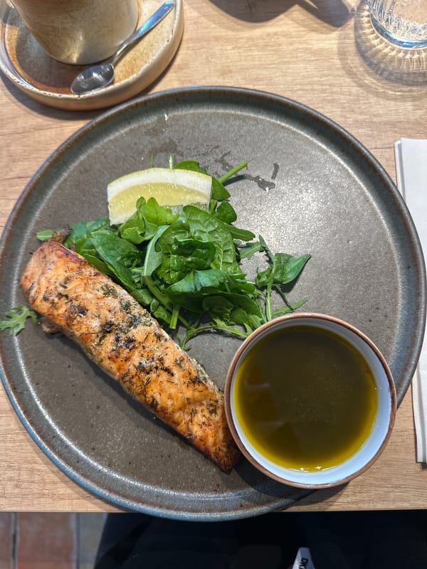 Diners document modern café with olive tree décor in Riga