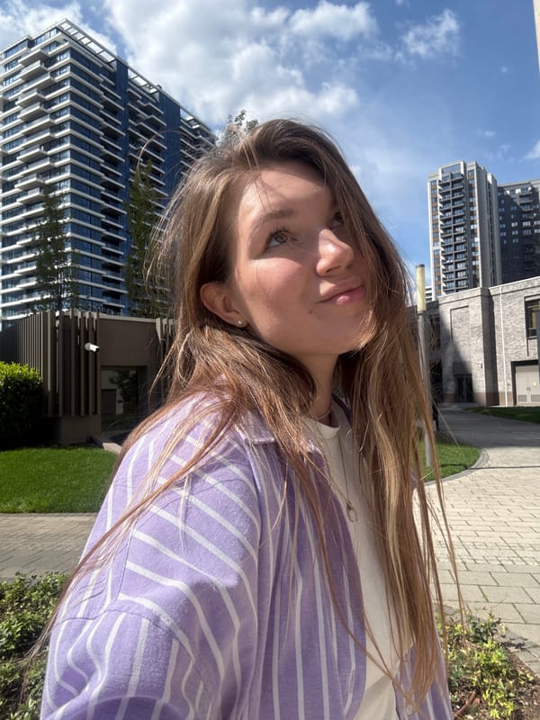 Woman in striped shirt photographed walking in Belgrade