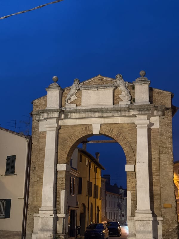 Historic archway photographed at dusk in Ravenna, Italy