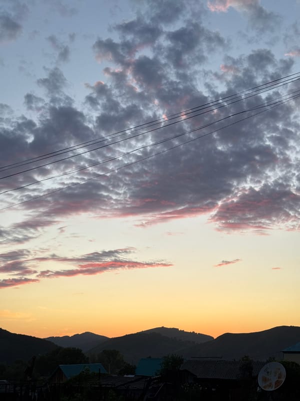 Evening moments in Soloneshnoye village under dramatic sunset skies