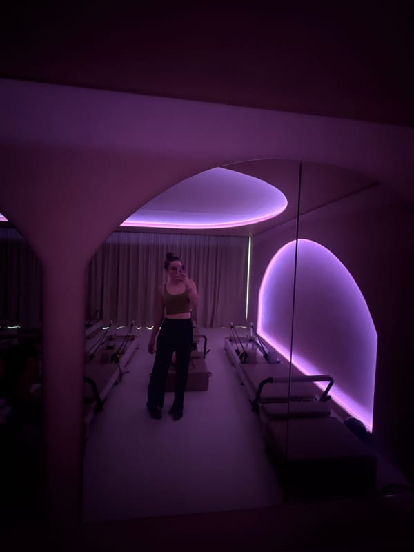 Evening Pilates session in purple-lit Mexico City studio