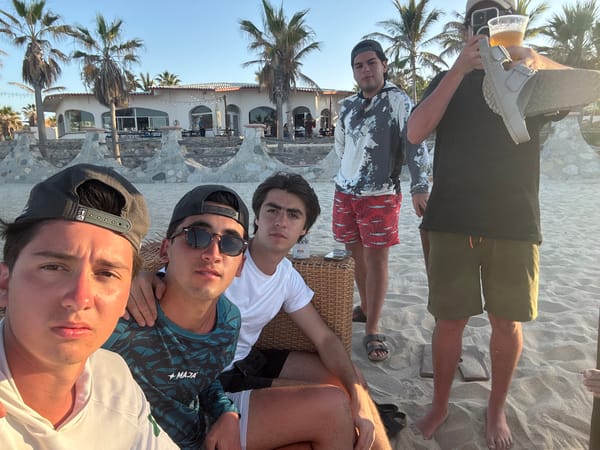 Young men gather for late night beach hangout in Mexico